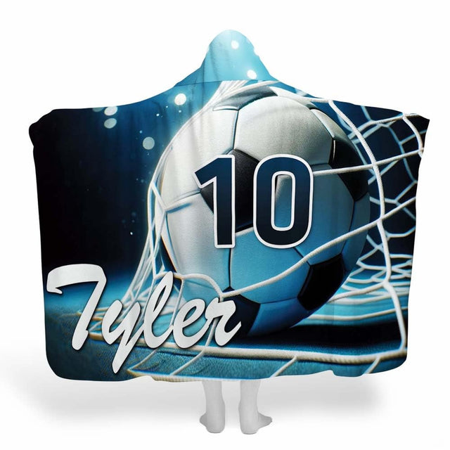 Display showing night stadium soccer blanket featuring ball in goal net under bright spotlights