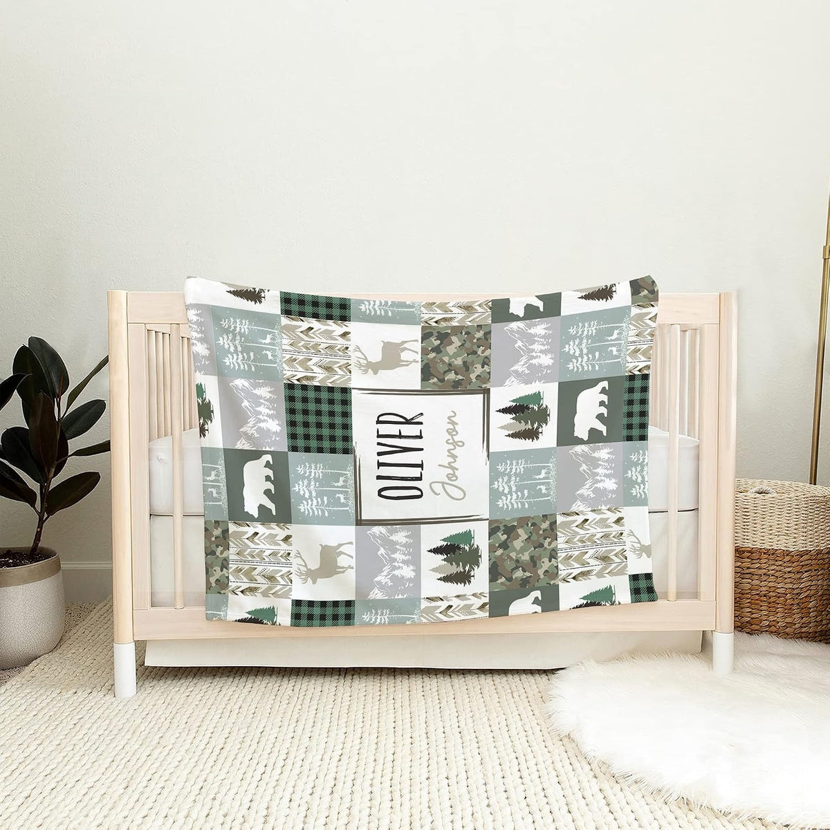 Forest wildlife graphic featuring deer silhouettes, mountain vistas, and camouflage patchwork blocks.