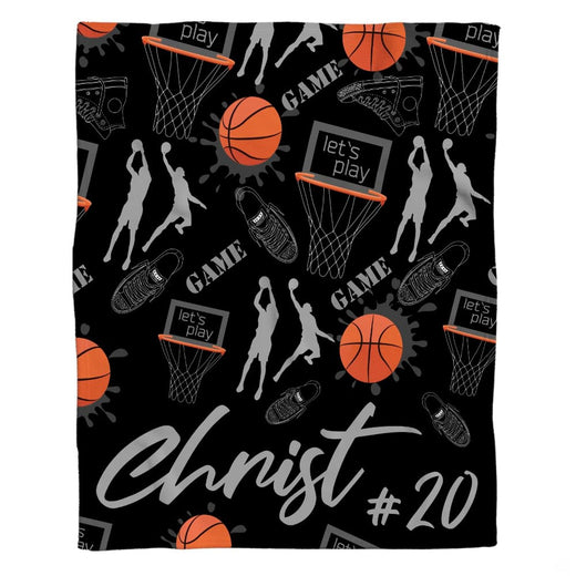 Basketball player and sneaker pattern throw blanket featuring hoops, basketballs, and shoes on black