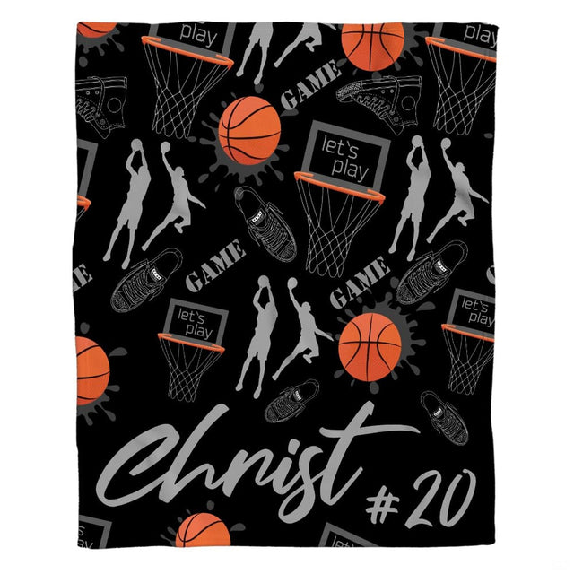 Basketball player and sneaker pattern throw blanket featuring hoops, basketballs, and shoes on black