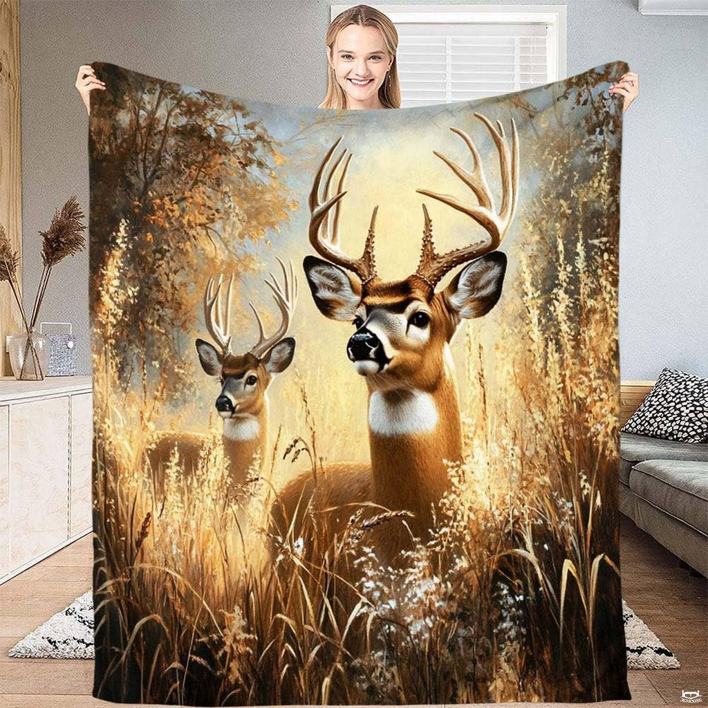 Model displaying whitetail deer bucks throw blanket with autumn meadow grass landscape