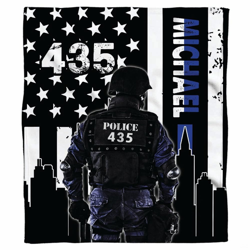 City skyline tactical police flag graphic blanket draped across sofa
