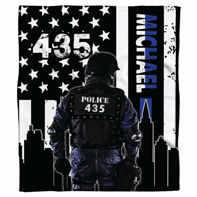 City skyline tactical police flag graphic blanket draped across sofa