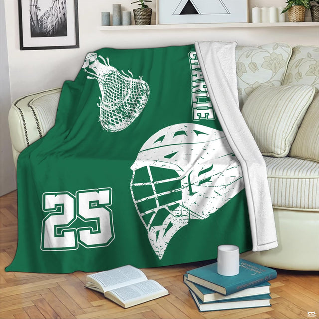 Graphic sports blanket draped across living room seating near a stack of books.