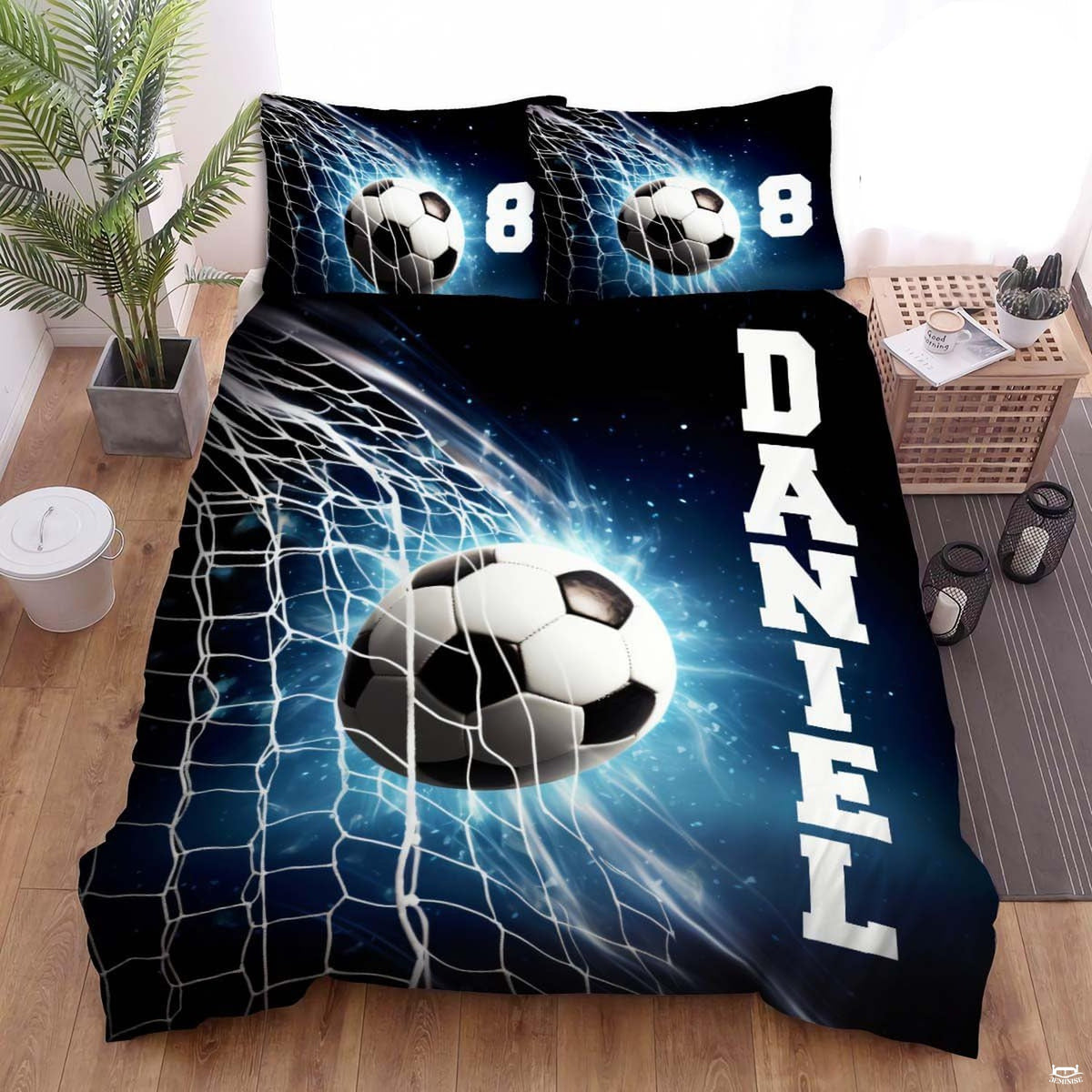 Blue soccer goalie net sports bedding featuring a soccer ball striking the goal net on a bed