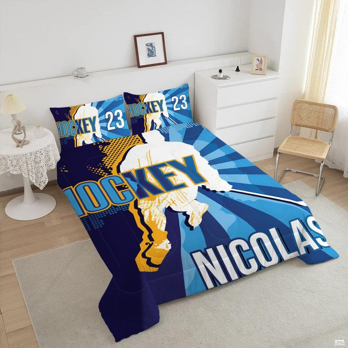 Close-up perspective of hockey bedding showing detailed stick artwork and golden halftone textures