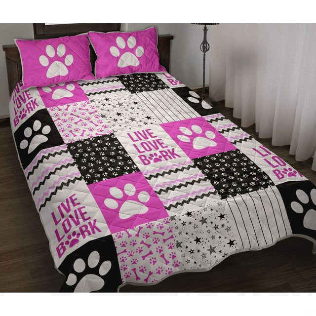Dog paw print clip art and bone collage in vibrant magenta pink and black on modern bedding.