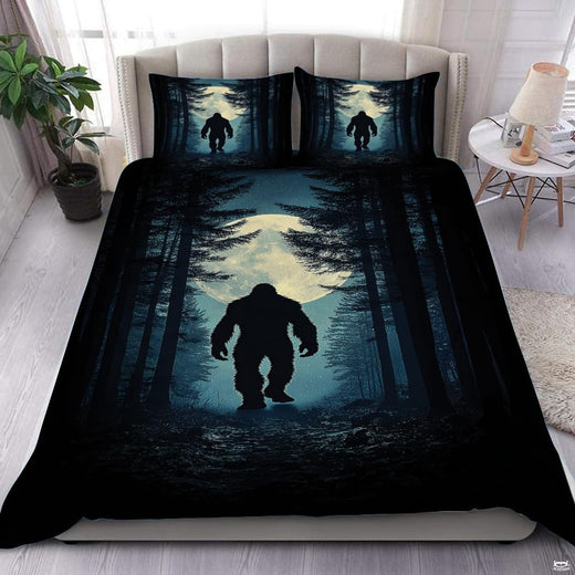 Midnight blue bigfoot silhouette bedding set showing a cryptid sasquatch walking across cool indigo and moonlit bands.
