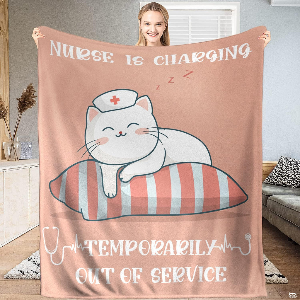 Sleeping nurse cat cartoon throw blanket featuring white kitten on striped pillow against pink background