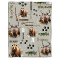 Bear hunt bedding design displaying a grizzly bear illustration, rustic tracks, and rifle motifs on earthy tones.