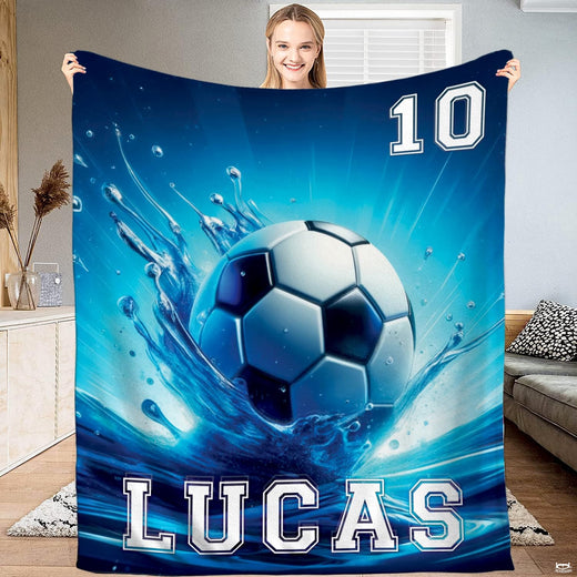 Soccer ball splashing into turquoise water waves with aqua energy rays on bedding set artwork.