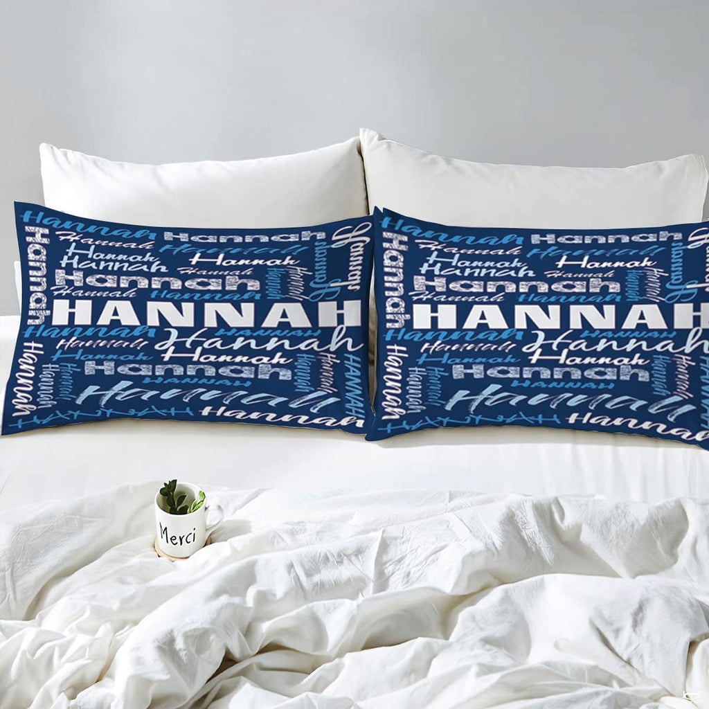 Overhead view of blue typography bedding spread across a contemporary bedroom bed