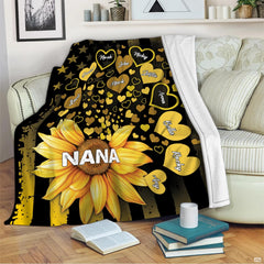 Living room display with the sunflower flag graphic draped over an armchair beside books.