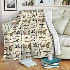 Rustic wildlife hunting and fishing throw blanket draped across a living room armchair
