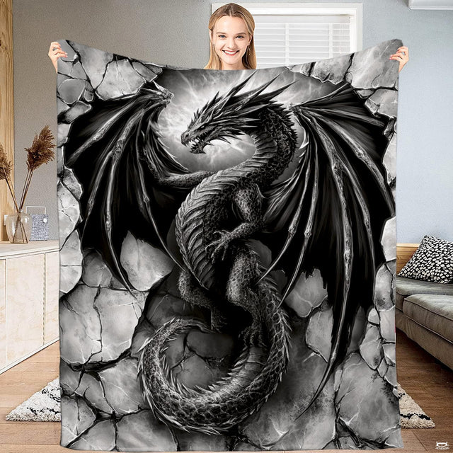 Gothic black dragon throw blanket featuring a fierce winged dragon emerging through cracked stone blocks in 3D realism