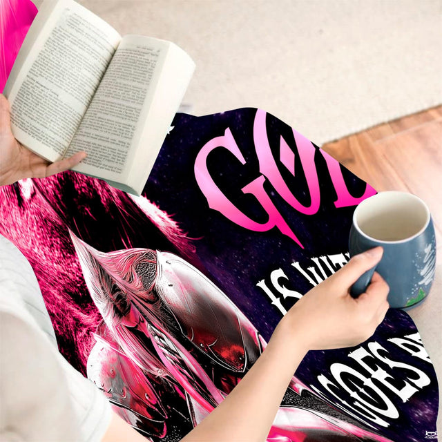 Faith-inspired design displayed indoors beside a hot beverage and an open book.