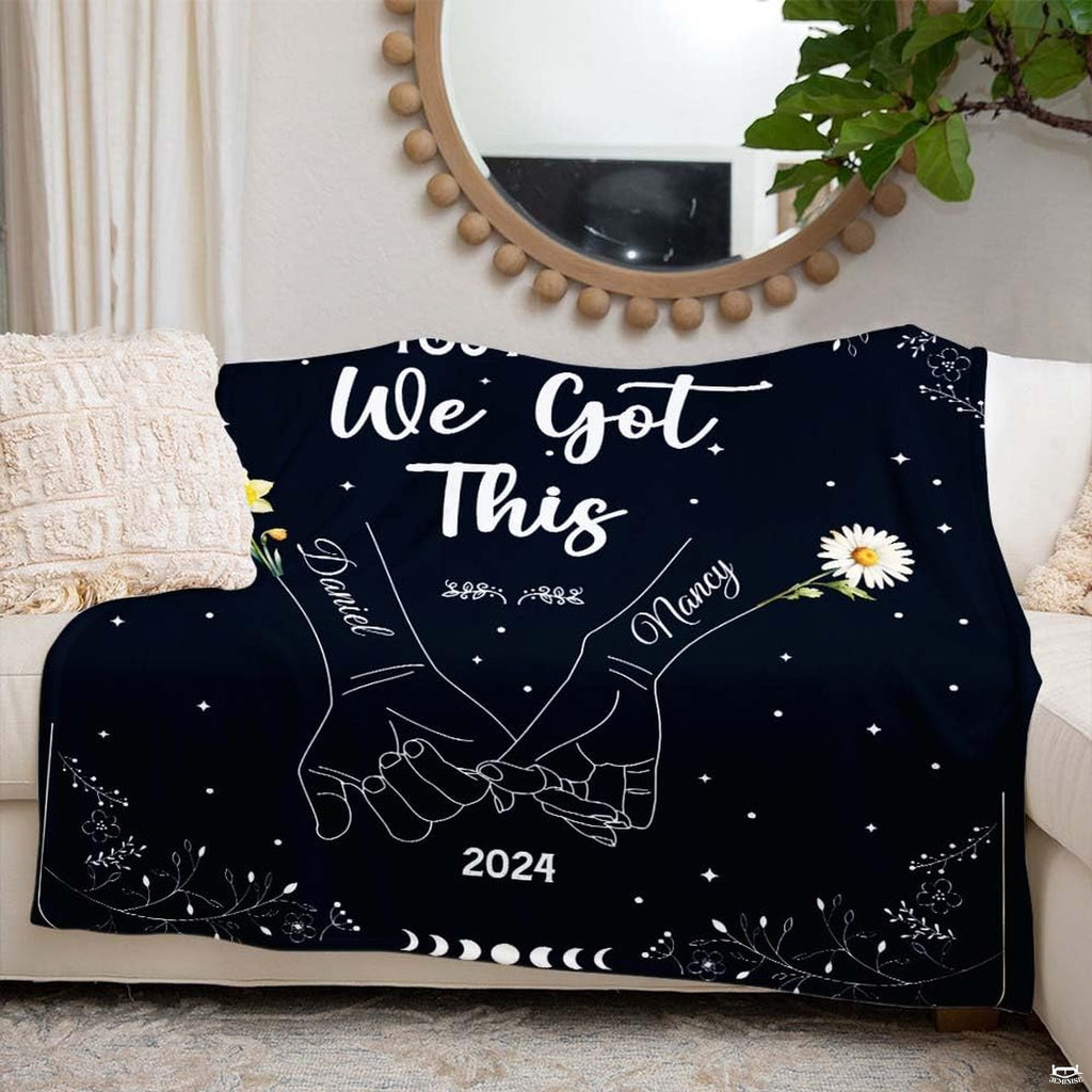 Romantic couple themed throw blanket draped across living room sofa seating.