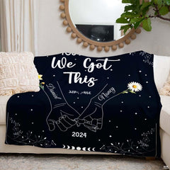 Romantic couple themed throw blanket draped across living room sofa seating.