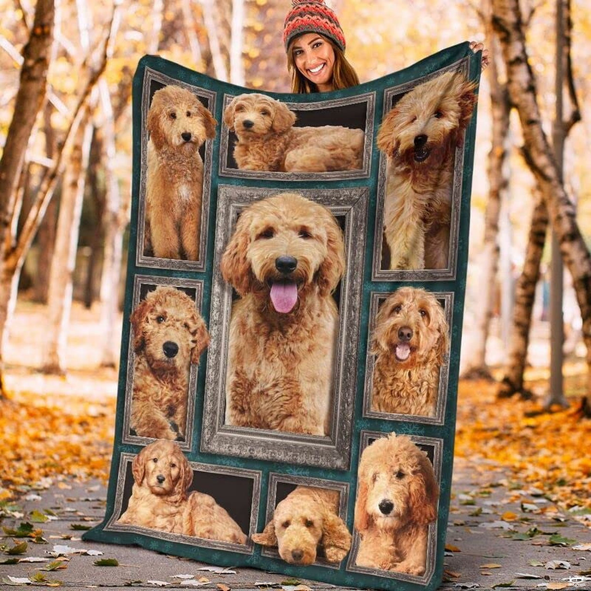 Framed doodle dog gallery graphic blanket draped across bedroom bed