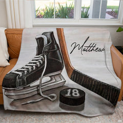 Ice hockey sports graphic blanket styled across bedroom bed