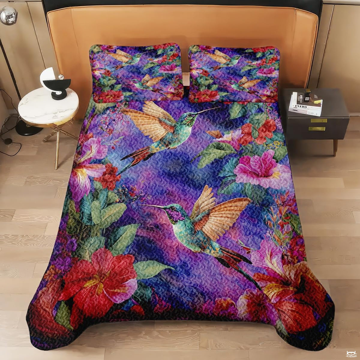 Overhead bed view with hummingbirds, flowers, and green leaves