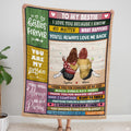 Frontal view held upright displaying two companions in winter knitwear framed by colorful wooden signboards.