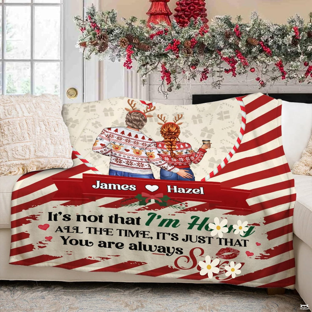 Holiday couple inside candy cane heart frame on diagonal peppermint stripes, view 5.