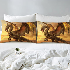 Overhead view of golden sunset mountain dragon bedding styled elegantly across an interior bedroom bed arrangement