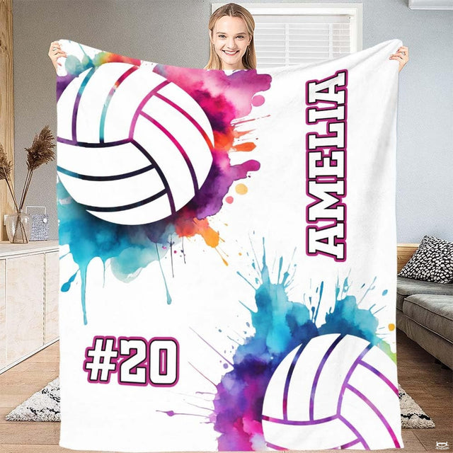 Stylized volleyball artwork surrounded by purple, cyan, and pink watercolor paint droplets in bedroom decor.