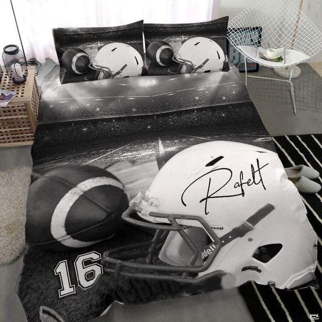 Close-up perspective of sports bedding detailing textured football lacing and athletic collegiate typography