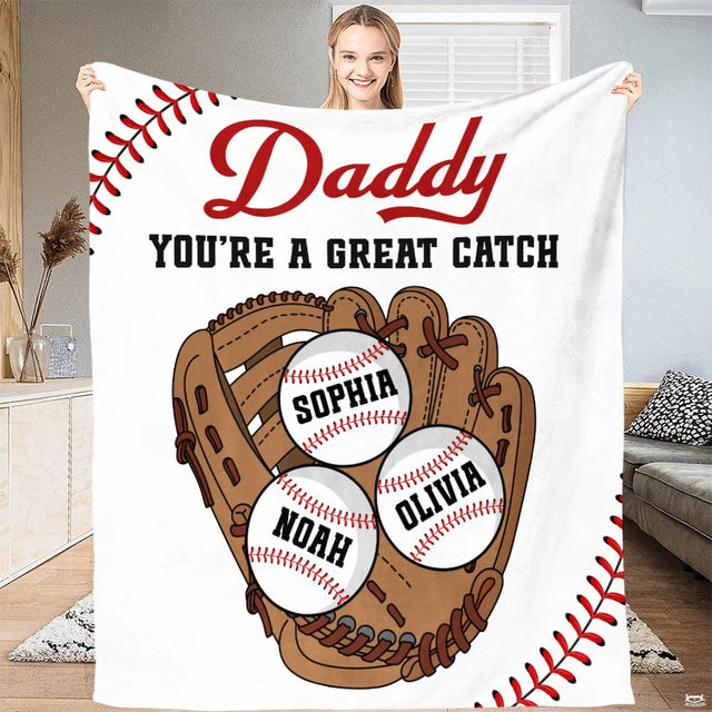 Full view of throw blanket displaying tan baseball mitt, three baseballs, and red corner lacing tracks.