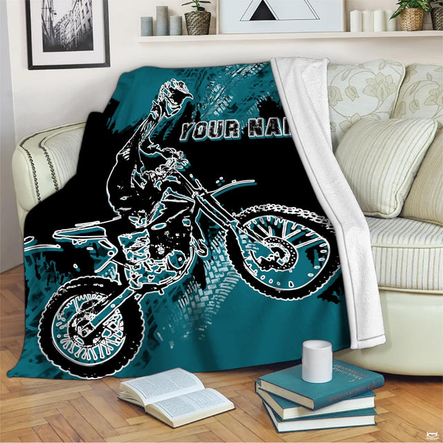 Teal and black motocross bedding featuring an airborne dirt bike rider in motion.