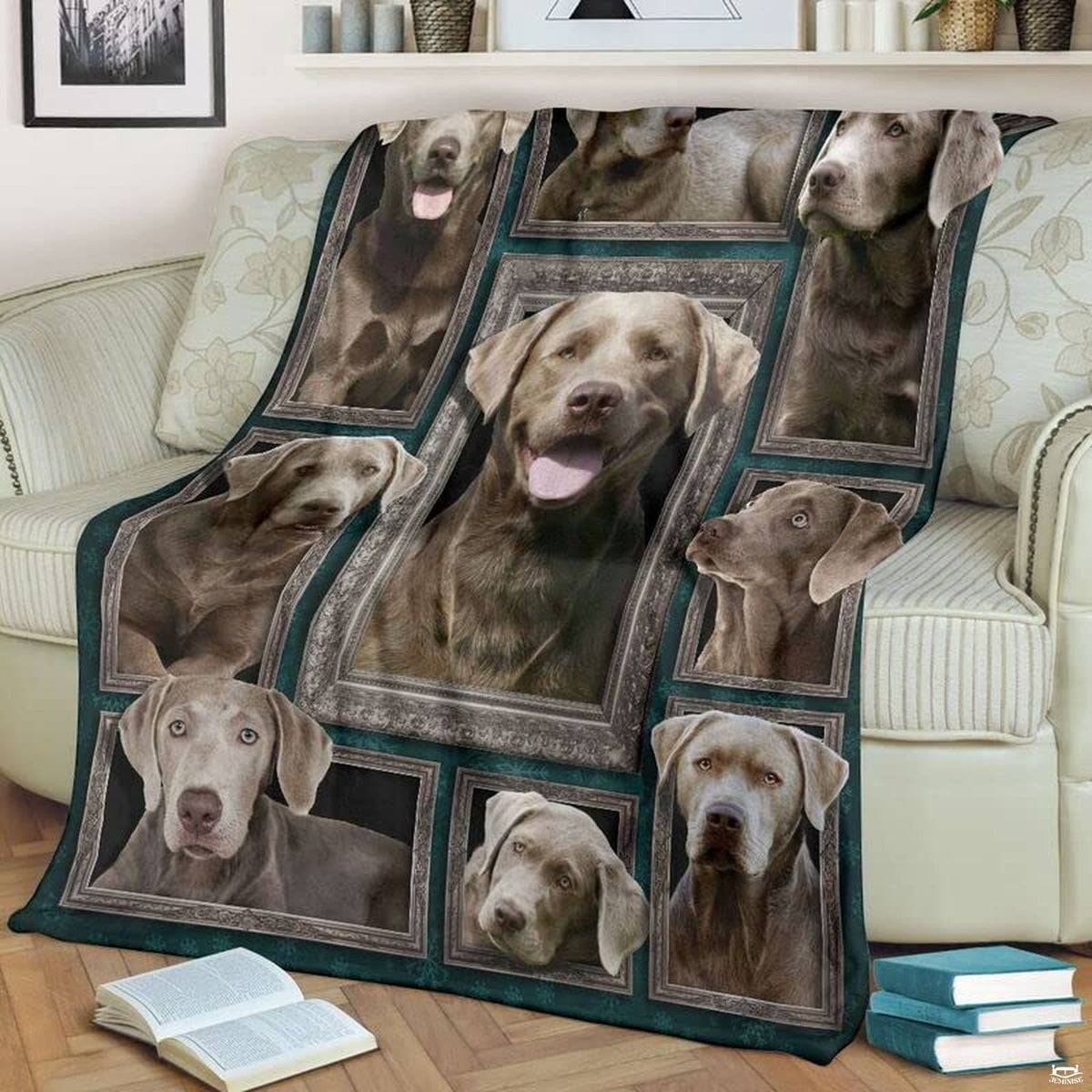 Close view of smiling silver lab in ornate silver picture frame on blanket