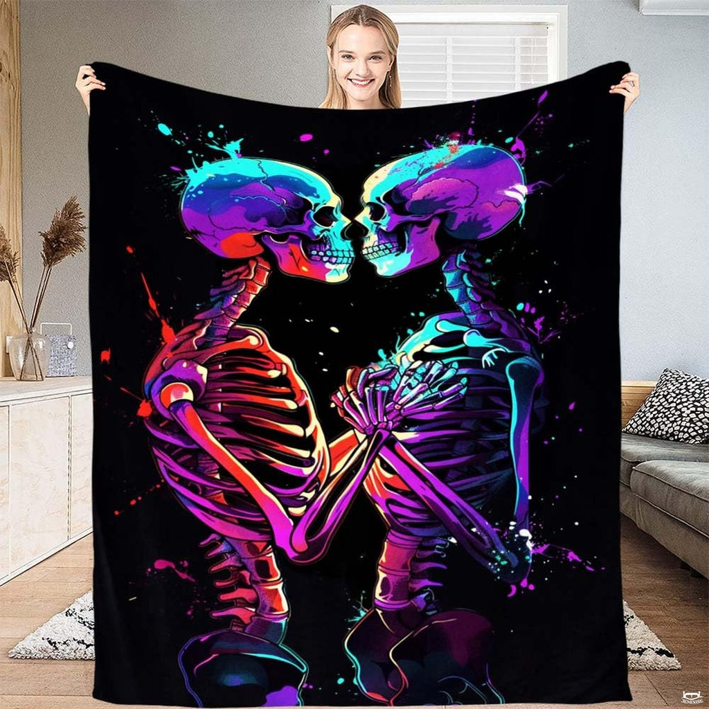 Neon paint splatter skeleton lovers throw blanket held open by woman