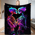 Neon paint splatter skeleton lovers throw blanket held open by woman