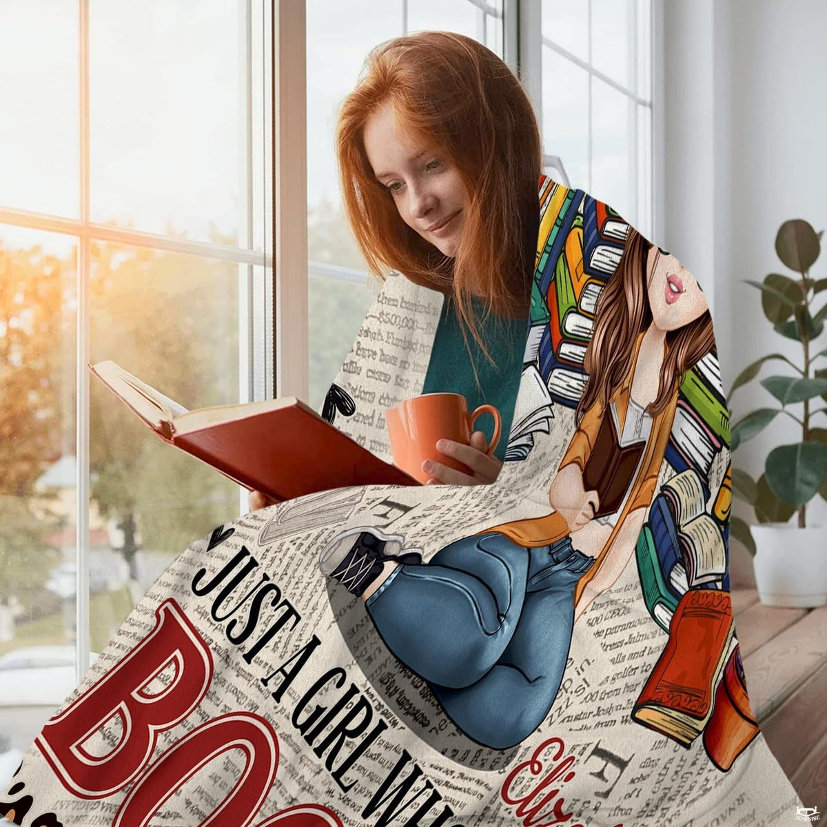 Window seating scene displaying the literary graphic wrapped around a reader holding an orange beverage mug.