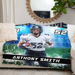 Quarterback football throw blanket view 3 highlighting athletic runner, green field turf, and stadium floodlights