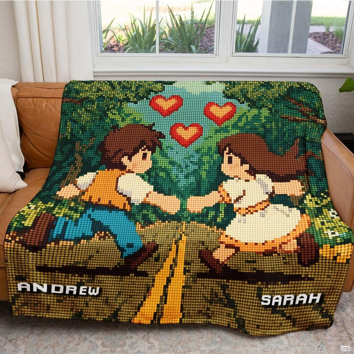 Close up of pixel art throw blanket highlighting 8-bit character mosaic pixels and woodland trees