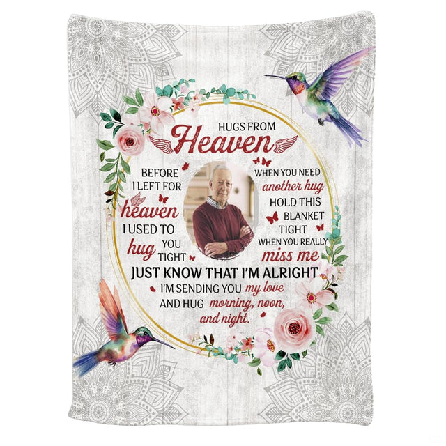 Hummingbird sympathy throw blanket styled over a neutral living room couch