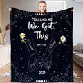Full view of throw blanket displaying pinky promise hands line art, daffodil, daisy, and moon phases.