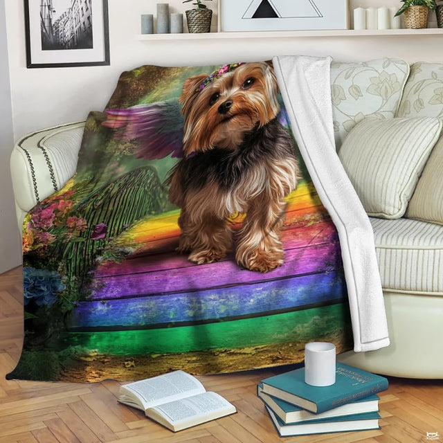 Close-up of angelic Yorkie dog wearing a flower crown surrounded by colorful garden blossoms.
