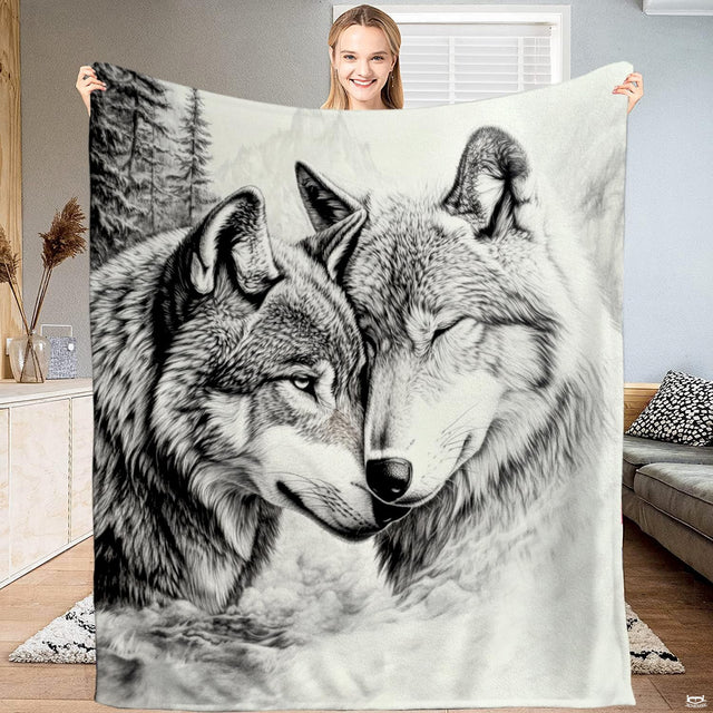 Wolf couple sketch throw blanket featuring a charcoal pencil drawing of two wolves in a snowy forest.