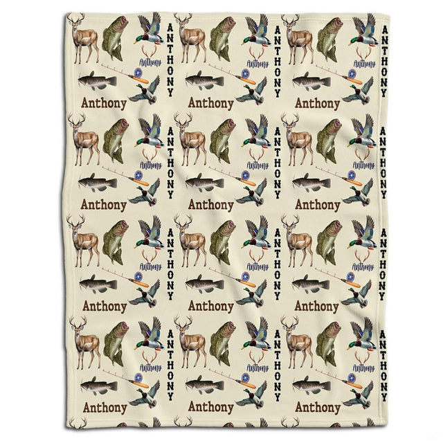 Rustic wildlife throw blanket featuring an outdoor pattern of whitetail deer, leaping bass, mallard ducks, and fishing rods