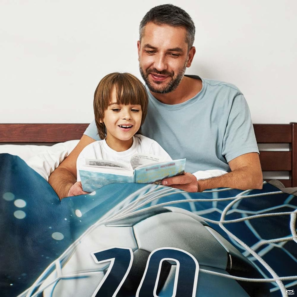 thematic accent athletic bedroom display highlighting the soccer ball graphic print against dark navy wall decor.