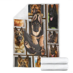 Folded corner and rolled layout of the German Shepherd blanket showing the white reverse side.