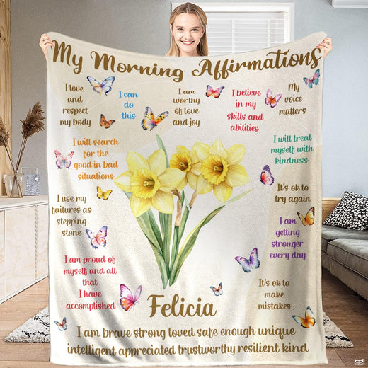 Daffodil botanical blanket featuring watercolor yellow flowers, butterflies, and quote lettering.
