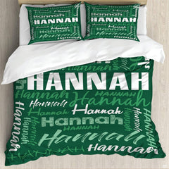 Forest green typography bedding featuring an interlocking word collage in block and script fonts on green backdrop