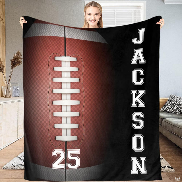 Woman holding up football throw blanket displaying detailed pebbled surface and white laces