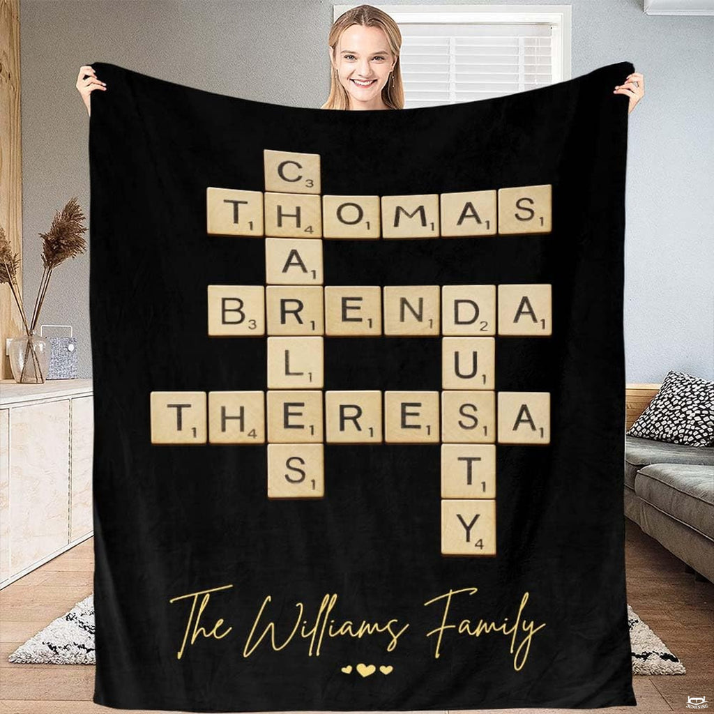 Black crossword letter tiles blanket featuring interlocking wooden alphabet tiles and golden accents.