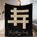 Black crossword letter tiles blanket featuring interlocking wooden alphabet tiles and golden accents.